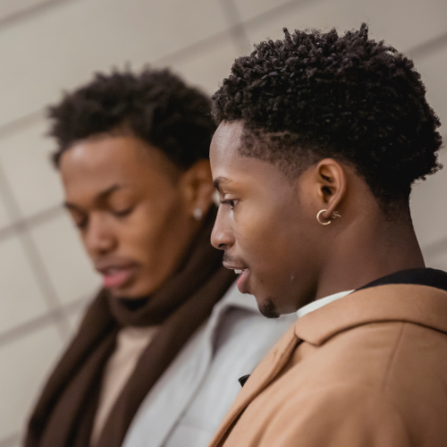 Two Black men in conversation