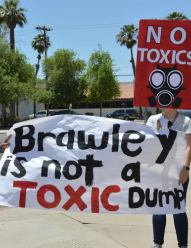 Brawley residents holding signs in protest large 640