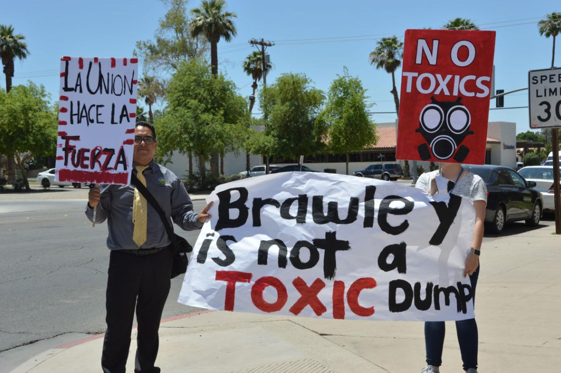 Brawley residents holding signs in protest large
