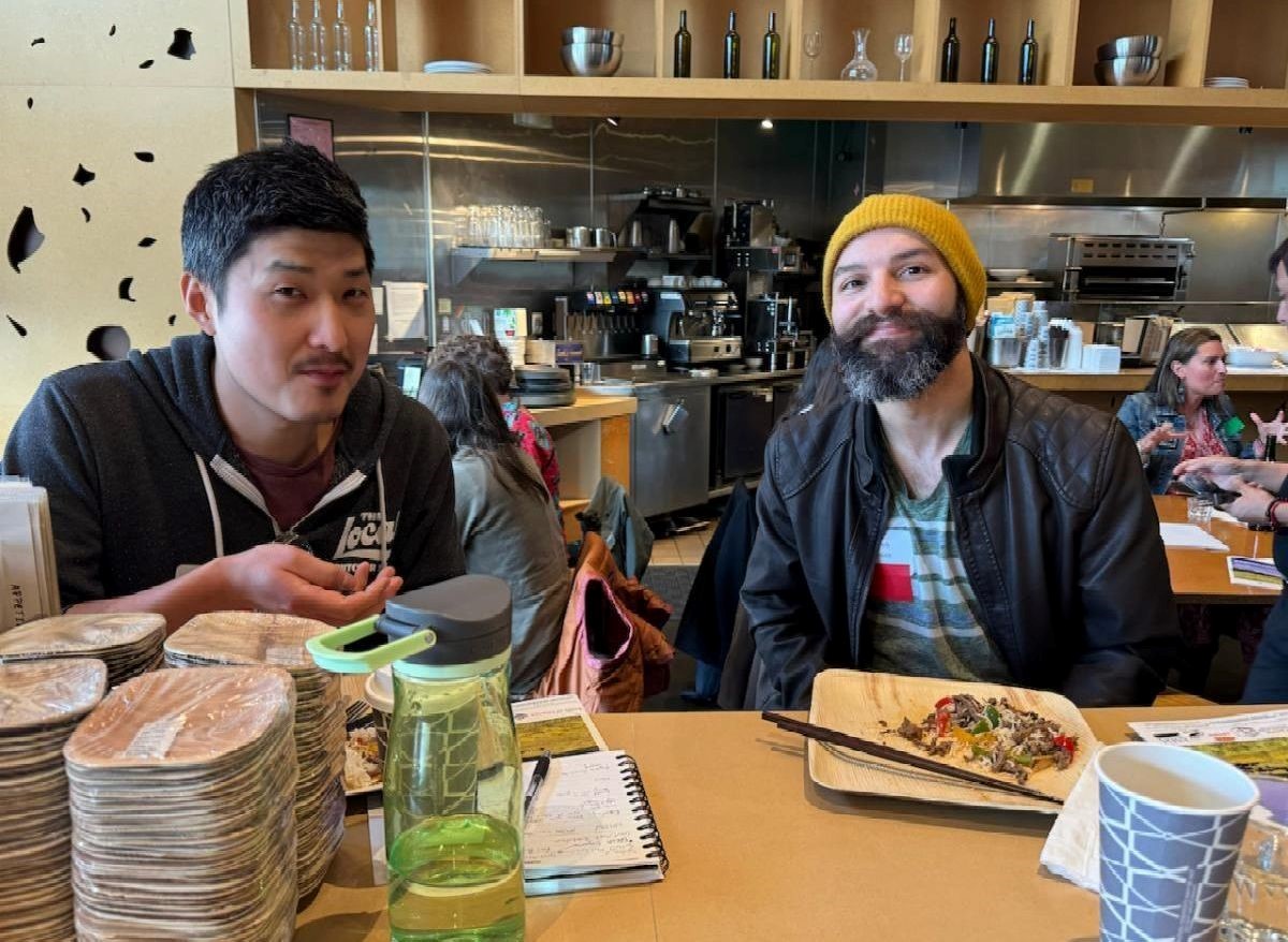 Koji Fujioka (l) and Caleb Avalos from The Local Butcher Shop, Berkeley, enjoying the Fajita lunch and taking a break
