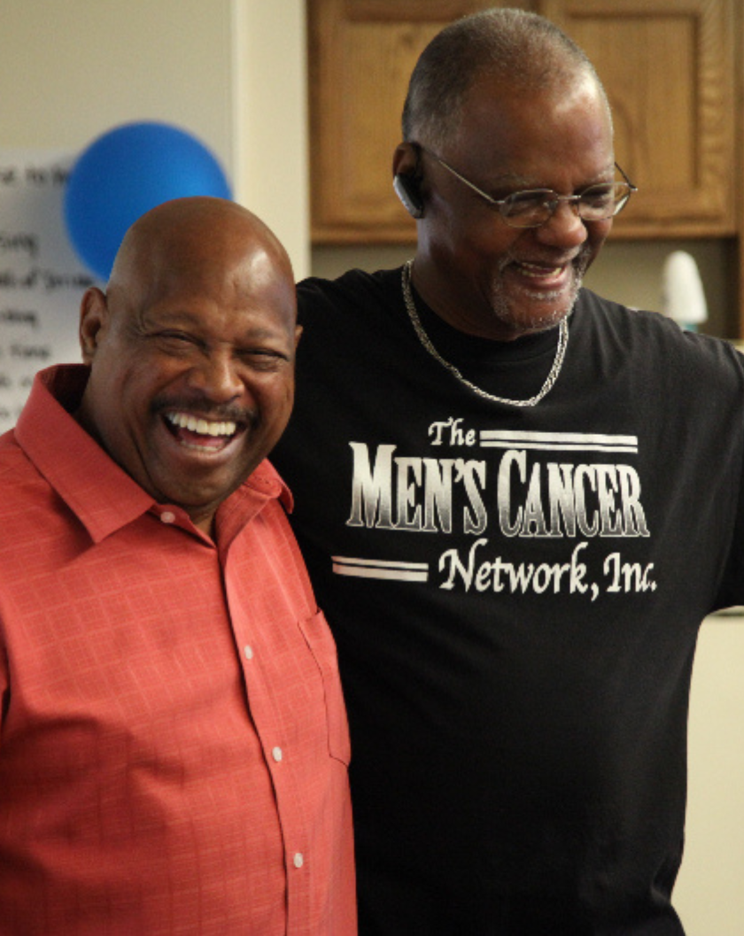 two Black men, participants in the RESPOND study, standing with their arms around each other
