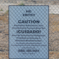 The area where PureGro used to be is fenced off with notices of that says caution no entry