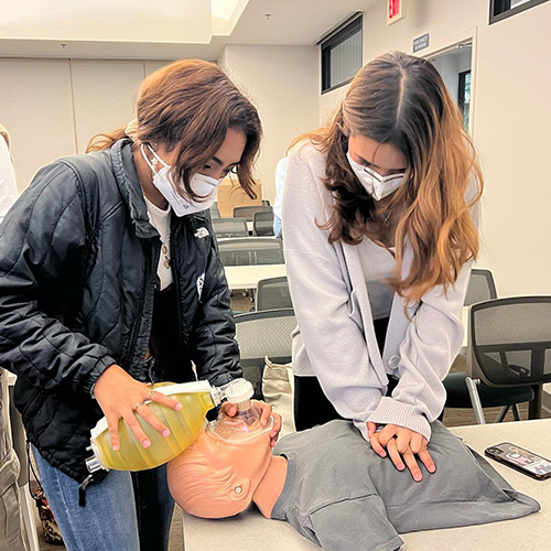 FACES students learning CPR