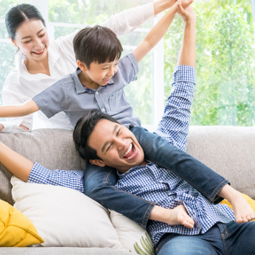 Asian fmaily on couch