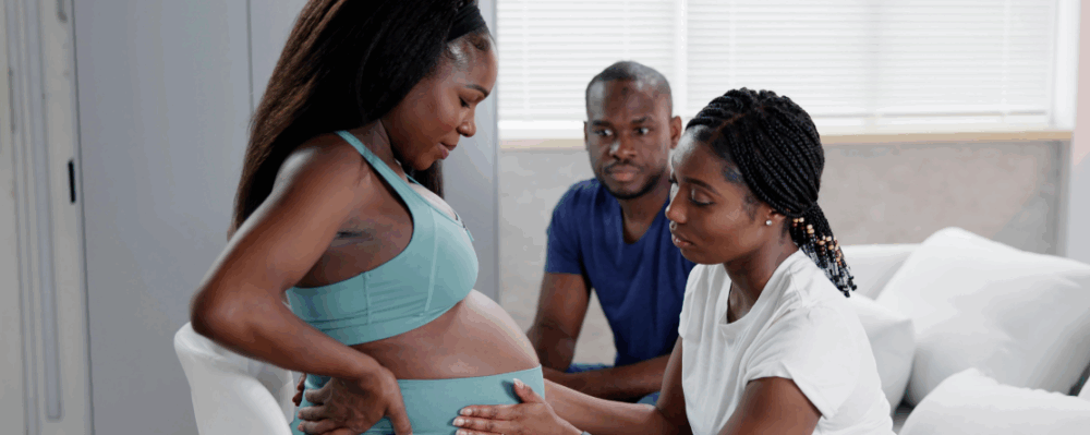 Black pregnant woman with support system of friends