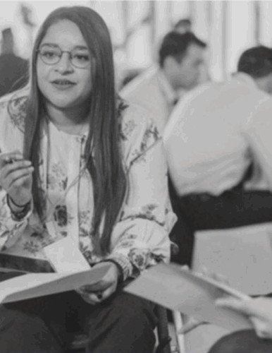 people meeting together, taking notes