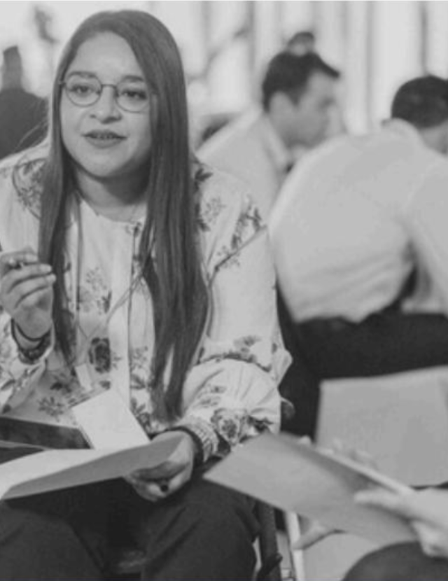 people meeting together, taking notes