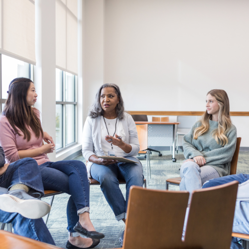 community members speaking in a circle