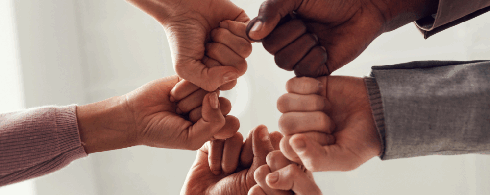 hands in a huddle