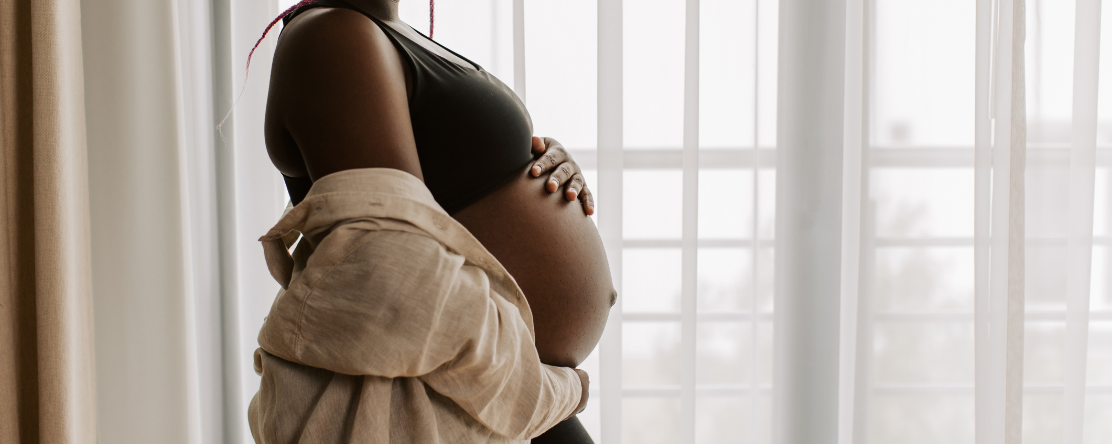 pregnant woman holding belly