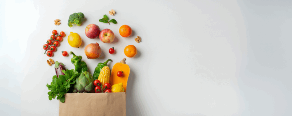 grocery bag with healthy fruits and vegetables