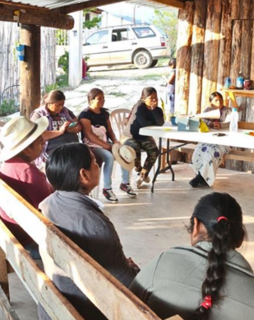 Group of people collaborating while sitting in circle