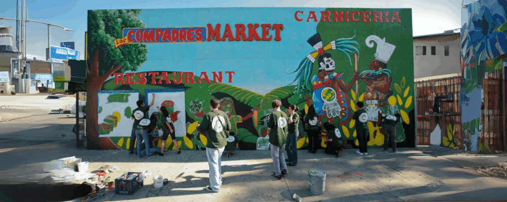 teens painting community mural