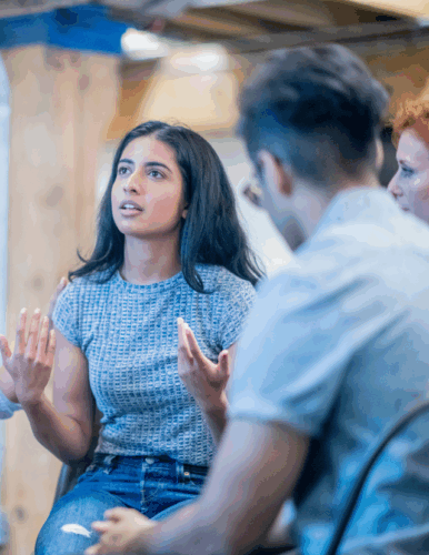 young woman telling story in a group circle