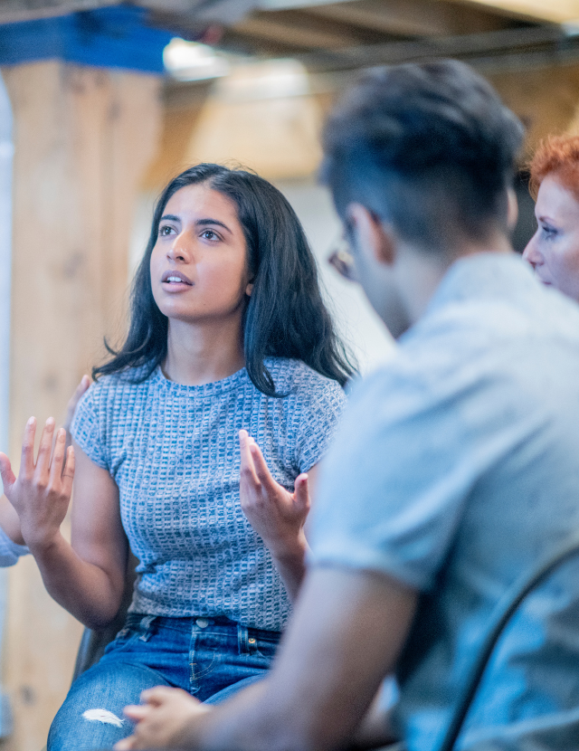 young woman telling story in a group circle
