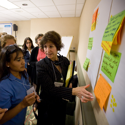 group of people learning from one another at meeting