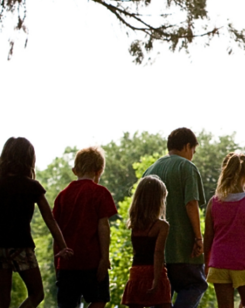 children outside by trees