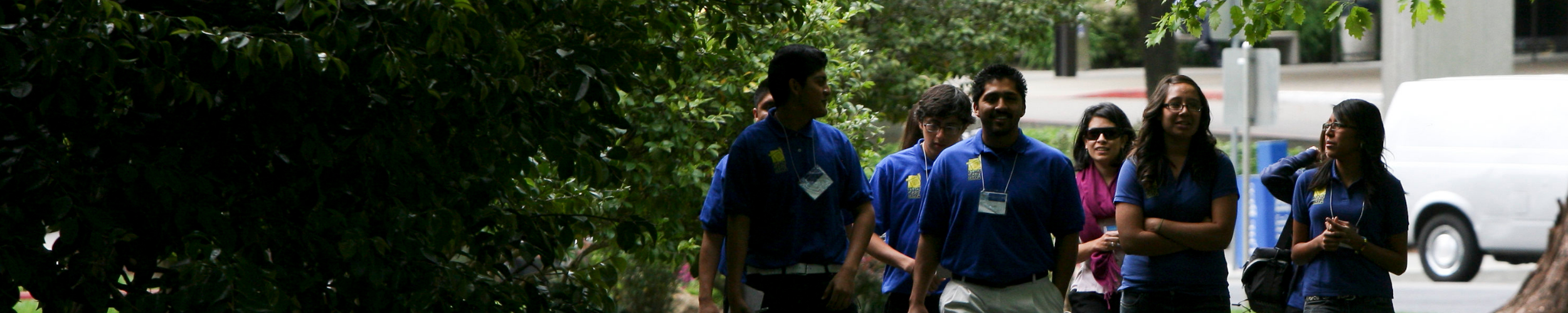 group of young people walking in the park